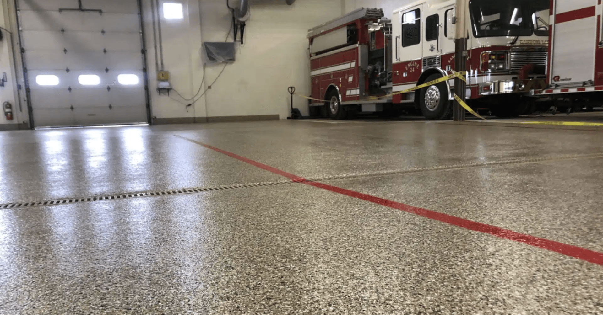 Fire station bay with red striping and resin floor — Greater Cleveland