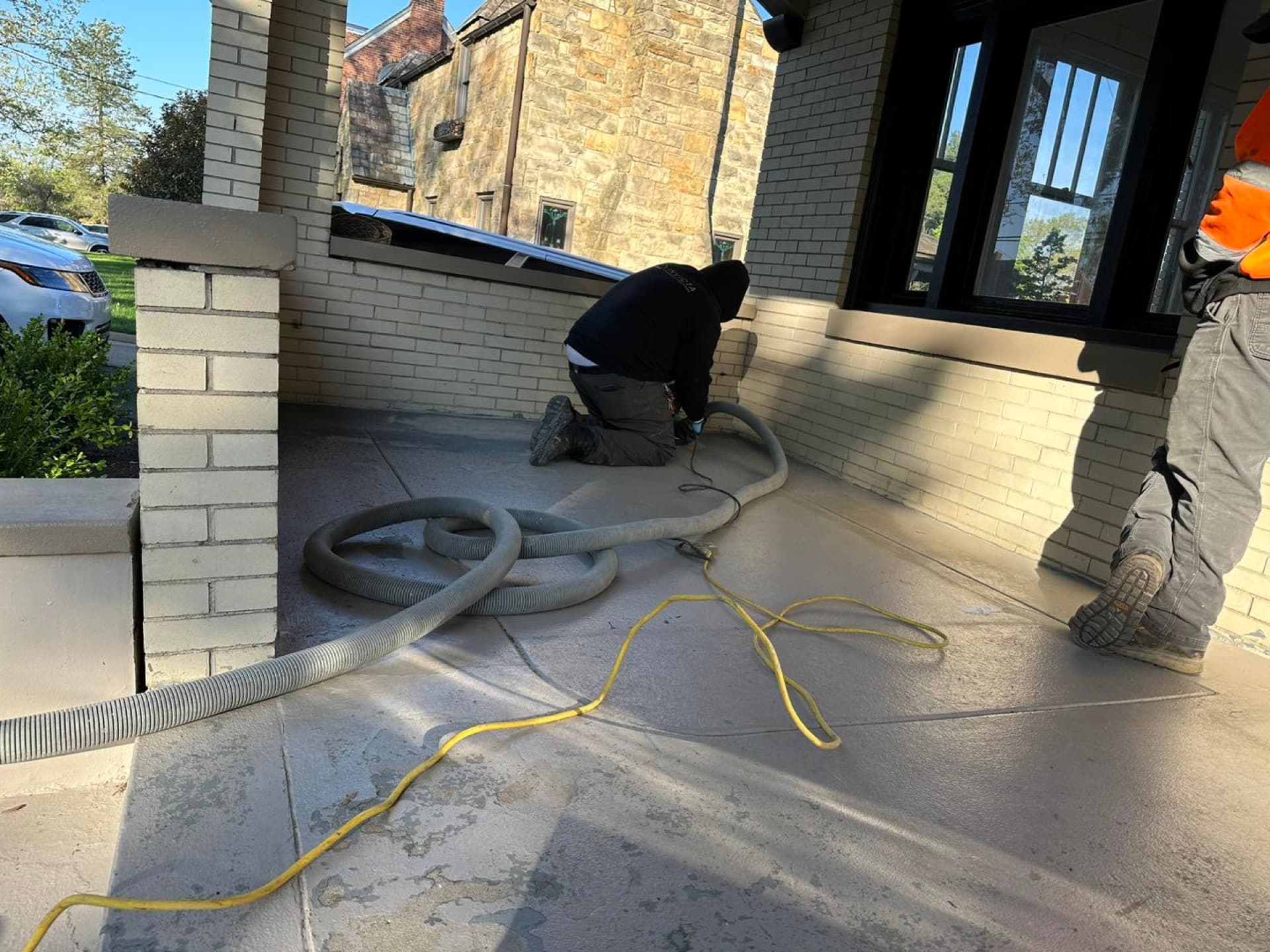 Crew preparing outdoor concrete for coating — Brunswick, OH